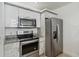 Modern kitchen with stainless steel appliances at 2211 San Vittorino Cir # 105, Kissimmee, FL 34741