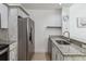 Modern kitchen with stainless steel appliances and granite countertops at 2211 San Vittorino Cir # 105, Kissimmee, FL 34741