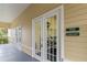 Fitness center entrance with glass doors and modern equipment visible from the hallway at 2211 San Vittorino Cir # 105, Kissimmee, FL 34741