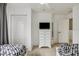 Well-lit bedroom with twin beds, dresser, and closet at 2211 San Vittorino Cir # 105, Kissimmee, FL 34741