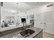 Modern kitchen with granite countertops, stainless steel sink, and open concept at 2211 San Vittorino Cir # 105, Kissimmee, FL 34741