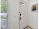 Bright and airy entryway with white door and modern keyless entry at 2211 San Vittorino Cir # 105, Kissimmee, FL 34741