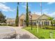 Community building exterior showcasing attractive landscaping and architectural details at 2211 San Vittorino Cir # 105, Kissimmee, FL 34741