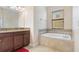 Bathroom with soaking tub, granite vanity, and a separate shower at 8940 Azalea Sands Ln # 8940, Davenport, FL 33896