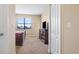 Bright bedroom with carpeted floors and views of the backyard at 8940 Azalea Sands Ln # 8940, Davenport, FL 33896