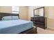 Bedroom with double bed and dresser at 8940 Azalea Sands Ln # 8940, Davenport, FL 33896