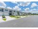Row of townhouses with garages and lush landscaping at 2609 Bright Jewel St # 2909, Kissimmee, FL 34746