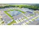 Aerial view of community with lake and townhomes at 2609 Bright Jewel St # 2909, Kissimmee, FL 34746