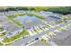 Aerial view of community with lake and townhomes at 2609 Bright Jewel St # 2909, Kissimmee, FL 34746