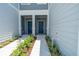 Townhouse entry with two doors and landscaping at 2609 Bright Jewel St # 2909, Kissimmee, FL 34746