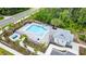 Drone view of community pool with surrounding landscaping at 2609 Bright Jewel St # 2909, Kissimmee, FL 34746