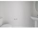 Simple bathroom with pedestal sink and toilet at 2609 Bright Jewel St # 2909, Kissimmee, FL 34746