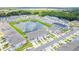 Aerial view of community with lake and townhomes at 2609 Bright Jewel St # 2909, Kissimmee, FL 34746