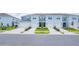 Front view of three-unit townhome building at 2609 Bright Jewel St # 2909, Kissimmee, FL 34746