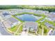 Aerial view of community with lake and townhomes at 2609 Bright Jewel St # 2909, Kissimmee, FL 34746