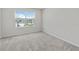 Bright bedroom with carpeted floors and backyard views at 2609 Bright Jewel St # 2909, Kissimmee, FL 34746