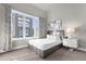 Comfortable guest bedroom with a queen bed and window at 7770 Sandy Ridge Dr # 227, Reunion, FL 34747
