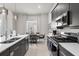 Contemporary kitchen featuring stainless steel appliances and a breakfast bar at 7770 Sandy Ridge Dr # 227, Reunion, FL 34747