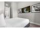 Bedroom with a queen bed and access to hallway at 7770 Sandy Ridge Dr # 227, Reunion, FL 34747
