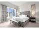 Spacious main bedroom with plush bed and large window at 7770 Sandy Ridge Dr # 227, Reunion, FL 34747