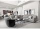 Open living room with sectional sofa and kitchen views at 7770 Sandy Ridge Dr # 227, Reunion, FL 34747