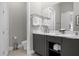 Elegant bathroom featuring double sinks and ample storage at 7770 Sandy Ridge Dr # 227, Reunion, FL 34747
