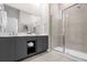 Modern bathroom with double vanity and large shower at 7770 Sandy Ridge Dr # 227, Reunion, FL 34747