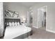 Cozy bedroom with a queen-size bed and access to hallway at 7770 Sandy Ridge Dr # 227, Reunion, FL 34747