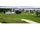 Aerial view of golf course and lakefront community at 30053 Island Club Dr, Tavares, FL 32778