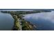 Aerial view of a scenic waterfront path and lush landscape at 30053 Island Club Dr, Tavares, FL 32778