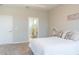 Bright main bedroom with plush carpeting, ensuite bathroom access, and plenty of natural light at 30053 Island Club Dr, Tavares, FL 32778