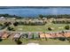 Stunning aerial showcasing lakefront property and golf course at 30053 Island Club Dr, Tavares, FL 32778