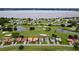 Community overview, showcasing lakefront homes and a golf course at 30053 Island Club Dr, Tavares, FL 32778