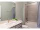 Clean bathroom with a bathtub, shower, and gray tile at 30053 Island Club Dr, Tavares, FL 32778