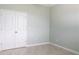 Spacious bedroom with double doors and light walls at 30053 Island Club Dr, Tavares, FL 32778