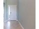Bright entryway with tile flooring and a white door at 30053 Island Club Dr, Tavares, FL 32778