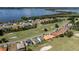 Bird's-eye view of lakefront homes and a golf course community at 30053 Island Club Dr, Tavares, FL 32778