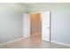 Bright bedroom with two doors leading to hallway and another room at 30053 Island Club Dr, Tavares, FL 32778