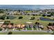 Community overview featuring houses, golf course, and lake at 30053 Island Club Dr, Tavares, FL 32778