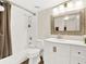 Updated bathroom with a white vanity, bathtub shower combo, and decorative mirror at 530 E Central Blvd # 802, Orlando, FL 32801