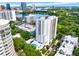 High-rise building with pool and city skyline in background at 530 E Central Blvd # 802, Orlando, FL 32801