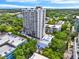 Aerial view showing a high-rise building, pool, and surrounding urban landscape at 530 E Central Blvd # 802, Orlando, FL 32801