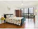 Serene bedroom with floral bedding and access to a private balcony at 530 E Central Blvd # 802, Orlando, FL 32801