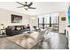 Spacious living room with city views, featuring modern furniture and a large TV at 530 E Central Blvd # 802, Orlando, FL 32801