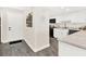 Modern kitchen with white cabinets, granite counters, and stainless steel appliances at 530 E Central Blvd # 802, Orlando, FL 32801