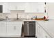 White kitchen with granite countertops and stainless steel dishwasher at 530 E Central Blvd # 802, Orlando, FL 32801