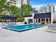 Inviting pool area with lounge chairs and a shaded seating area at 530 E Central Blvd # 802, Orlando, FL 32801