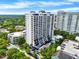 Aerial view of a high-rise building with city views and lush landscaping at 530 E Central Blvd # 802, Orlando, FL 32801