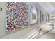 Hallway with modern art pieces adding to the building's appeal at 150 E Robinson St # 1709, Orlando, FL 32801