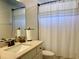 Clean bathroom with tub shower, vanity, and updated fixtures at 4739 Spring Grove Ln, Leesburg, Fl, FL 34748